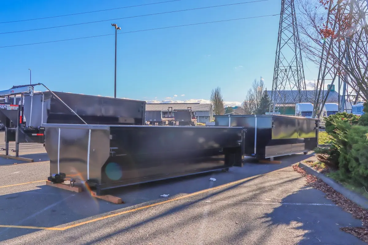 Roll-off dumpster ready for waste disposal at job site for 2 Yard Dumpster Rental in East Allen